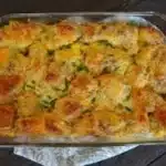 Breakfast casserole with biscuits, eggs, and cheese baked until golden brown