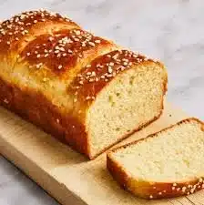 Freshly baked brioche loaf with a golden crust and soft texture.