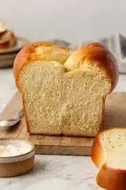 Freshly baked brioche bread with a golden crust and fluffy texture