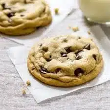 Freshly baked chocolate chip cookies on a cooling rack