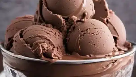 Delicious chocolate custard ice cream served in a bowl topped with chocolate shavings