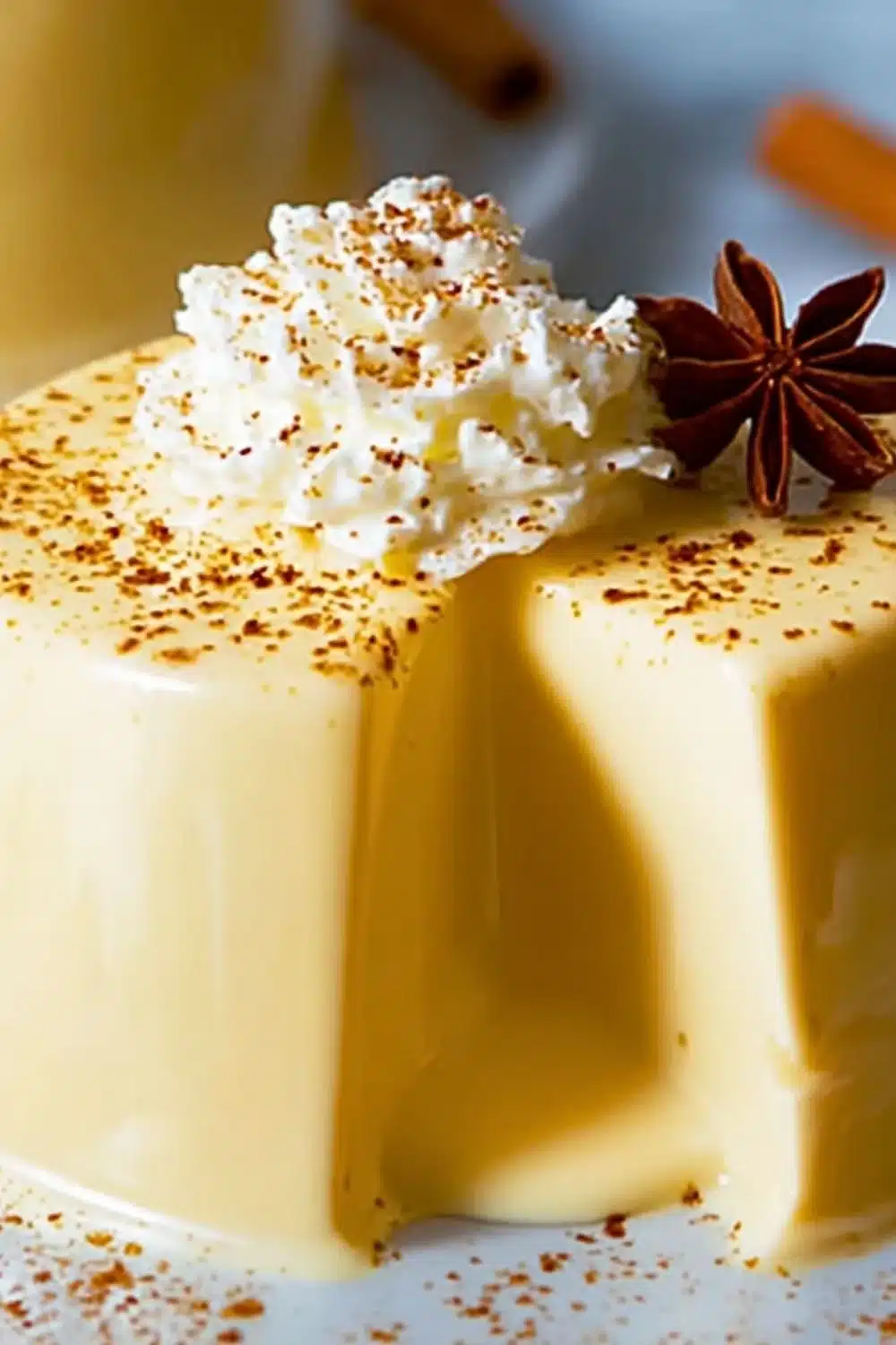 Delicious creamy Eggnog Panna Cotta served with festive garnishes