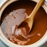 Crock Pot Hot Chocolate served in a mug with marshmallows and chocolate drizzles