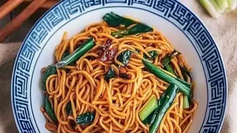 Bowl of delicious longevity noodles, symbolizing prosperity and joy in Chinese culture.