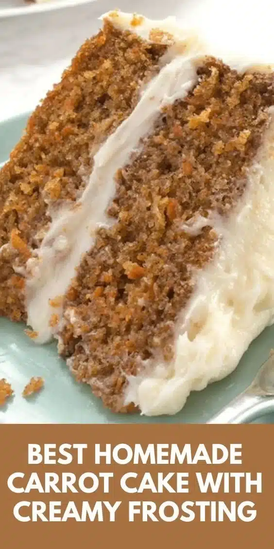 Delicious easy carrot cake topped with cream cheese frosting on a wooden table