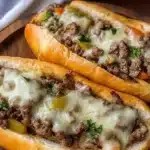 Ground Beef Philly Cheesesteaks served in a toasted hoagie roll