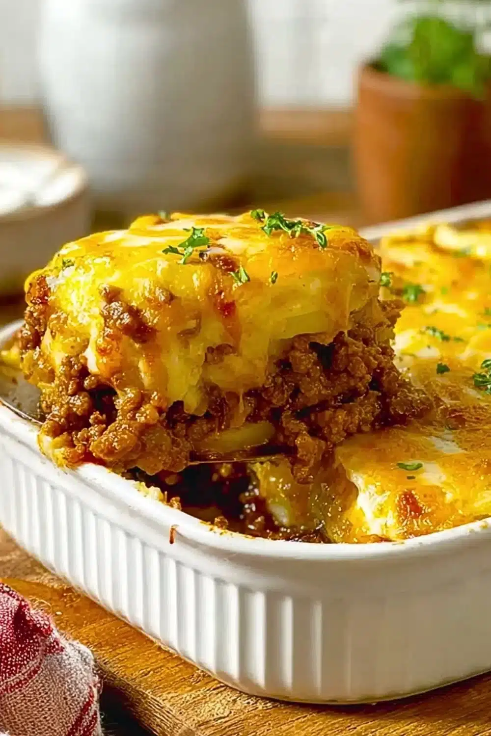 A delicious hearty beef casserole with potatoes served in a baking dish.