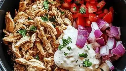 Delicious slow cooker chicken shawarma served on a plate with sides.