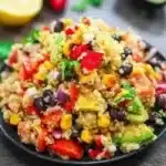 Colorful Mexican Street Corn Quinoa Salad topped with cilantro and lime