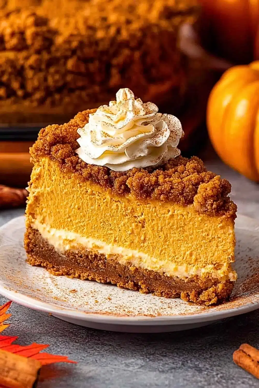 Slice of Pumpkin Streusel Cheesecake topped with crunchy streusel crust