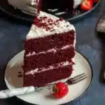 Delicious slice of Red Velvet Cake with cream cheese frosting