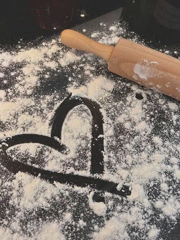 A joyful mum baking in the kitchen, bringing calm through baking joy.