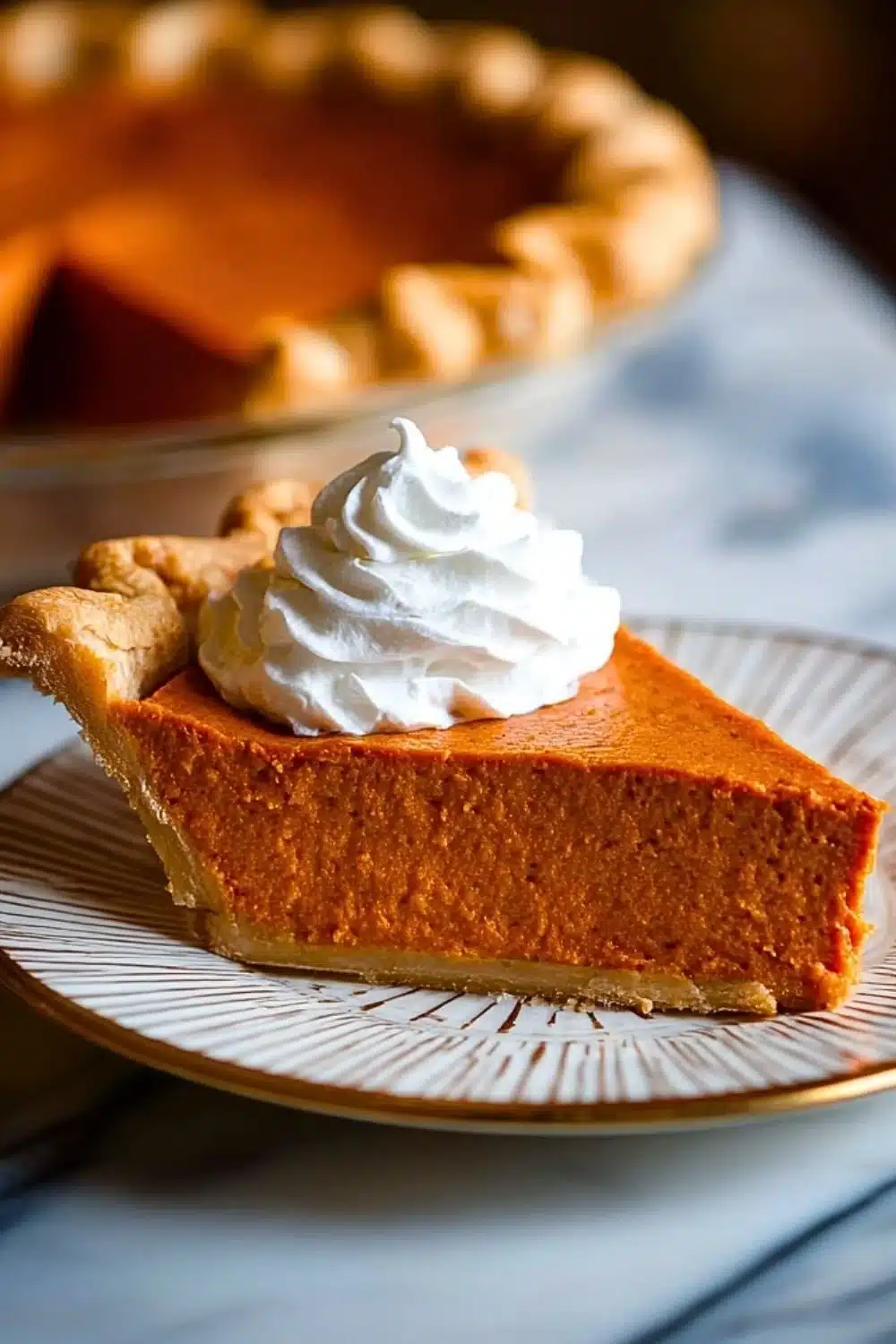Delicious Southern sweet potato pie slice on a rustic wooden table