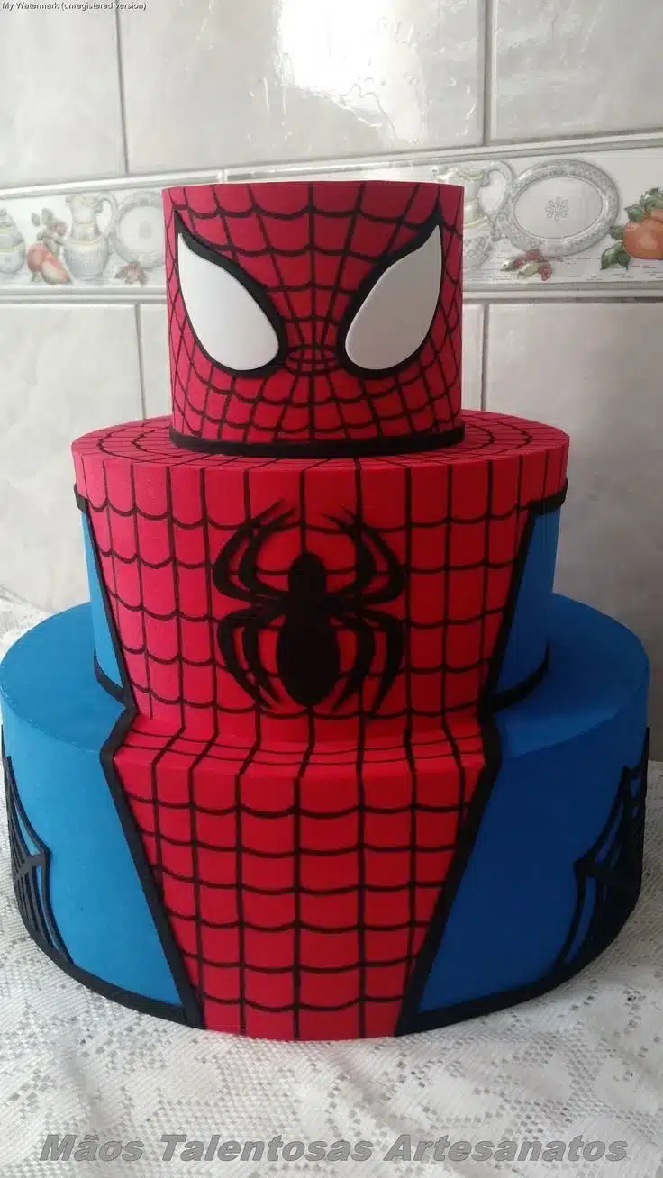 Three-tiered Spiderman birthday cake decorated for a superhero party