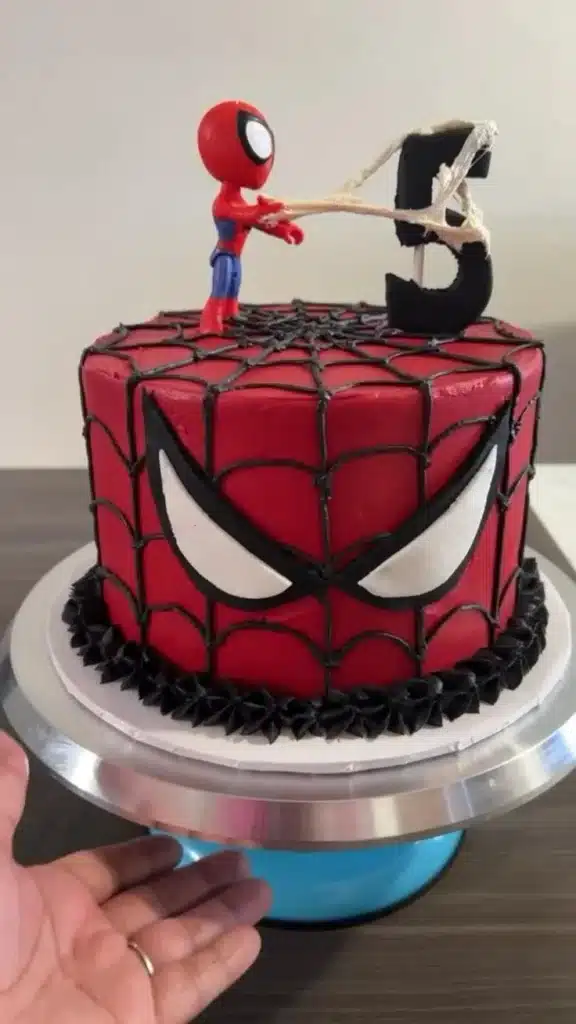 Delicious Spiderman cake decorated with vibrant colors and web design.