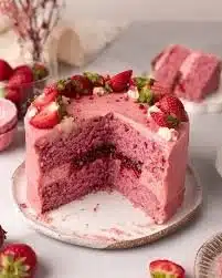 Delicious homemade strawberry cake with fresh strawberries and frosting