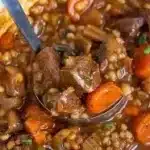 Delicious bowl of beef barley soup with tender beef, barley, and vegetables