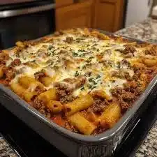 A delicious plate of best ever baked ziti with melted cheese and marinara sauce
