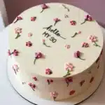 Beautiful flower cake decoration on a birthday cake with vibrant floral designs.