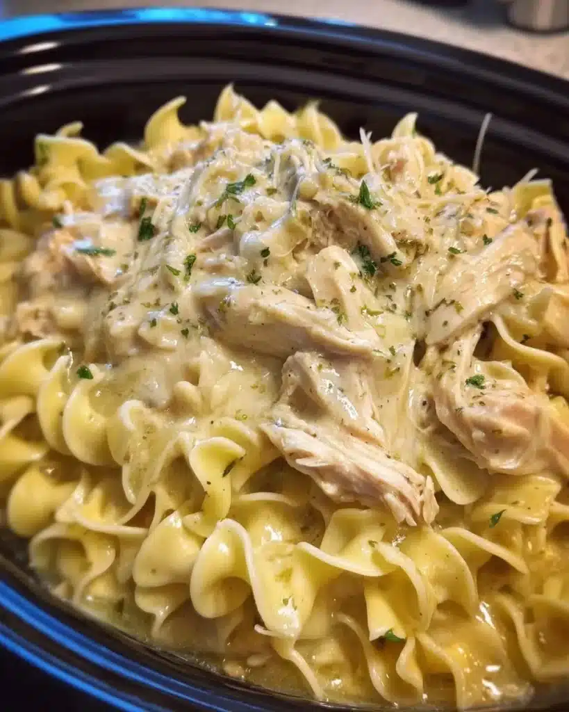 Delicious crockpot chicken and noodles served in a bowl.