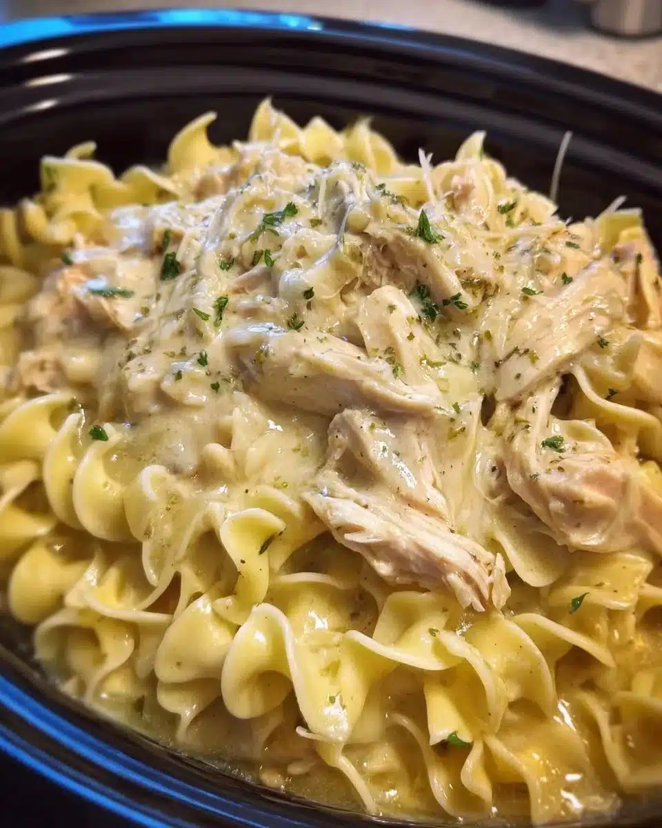 Delicious crockpot chicken and noodles served in a bowl.