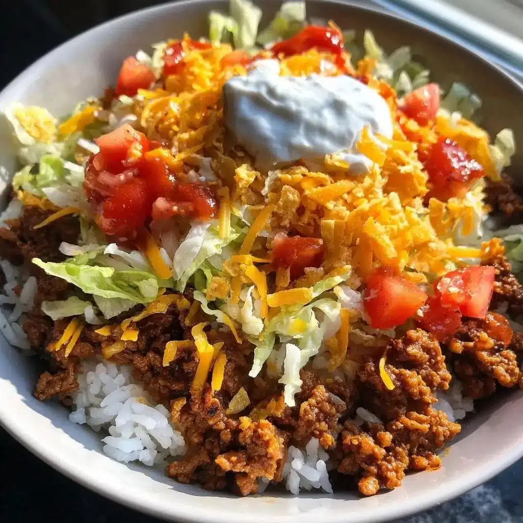 Crunchy taco rice bowl topped with Doritos, colorful and delicious meal.