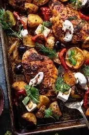Delicious Greek Sheet Pan Chicken with vibrant vegetables and herbs.