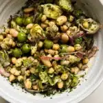 Delicious marinated Za'atar Bean Salad with fresh herbs and spices.