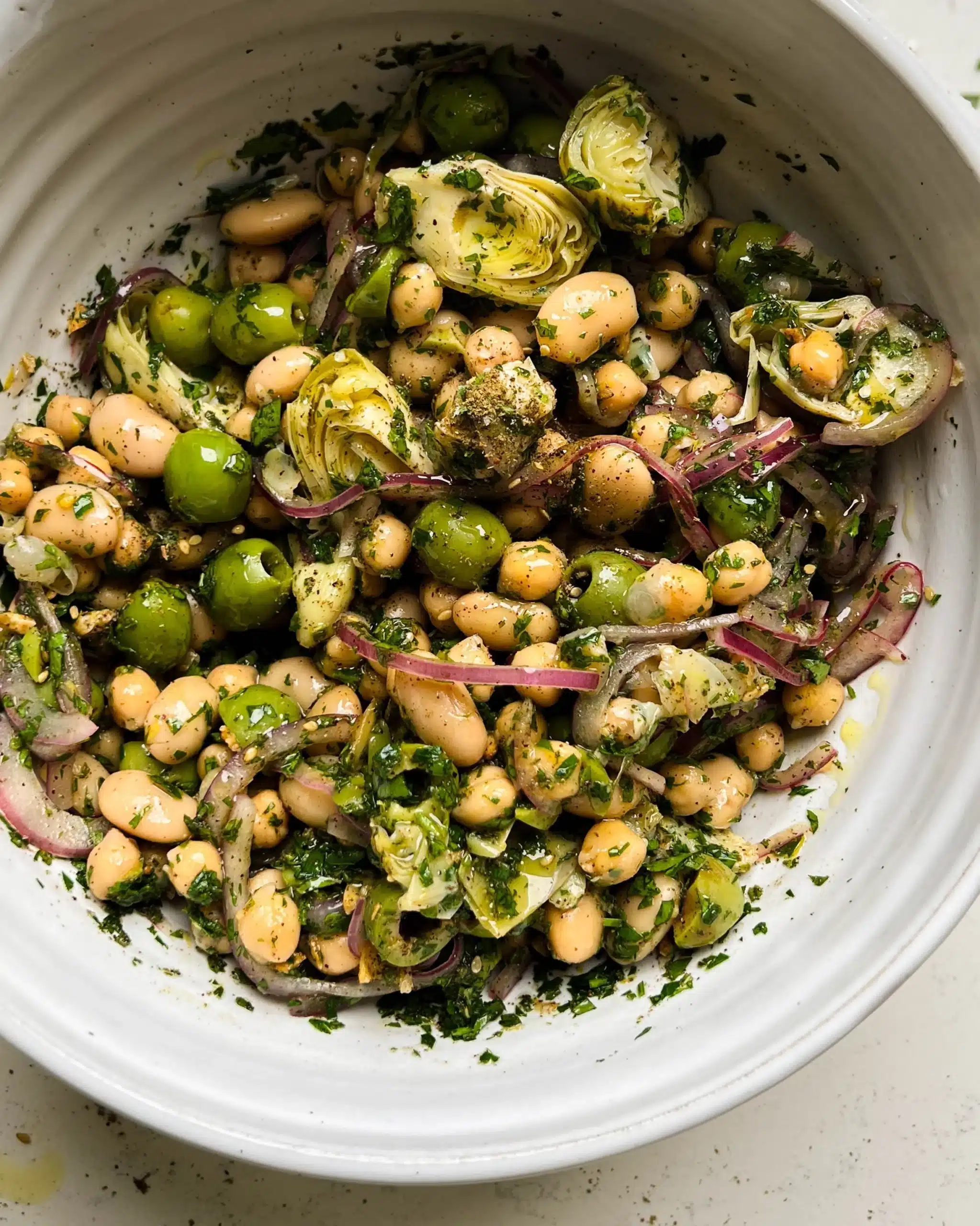 Delicious marinated Za'atar Bean Salad with fresh herbs and spices.