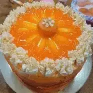 Delicious orange creamsicle cake with creamy frosting and fresh orange slices
