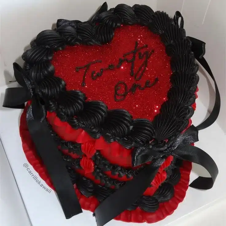Red and black 21st birthday cake with decorative elements