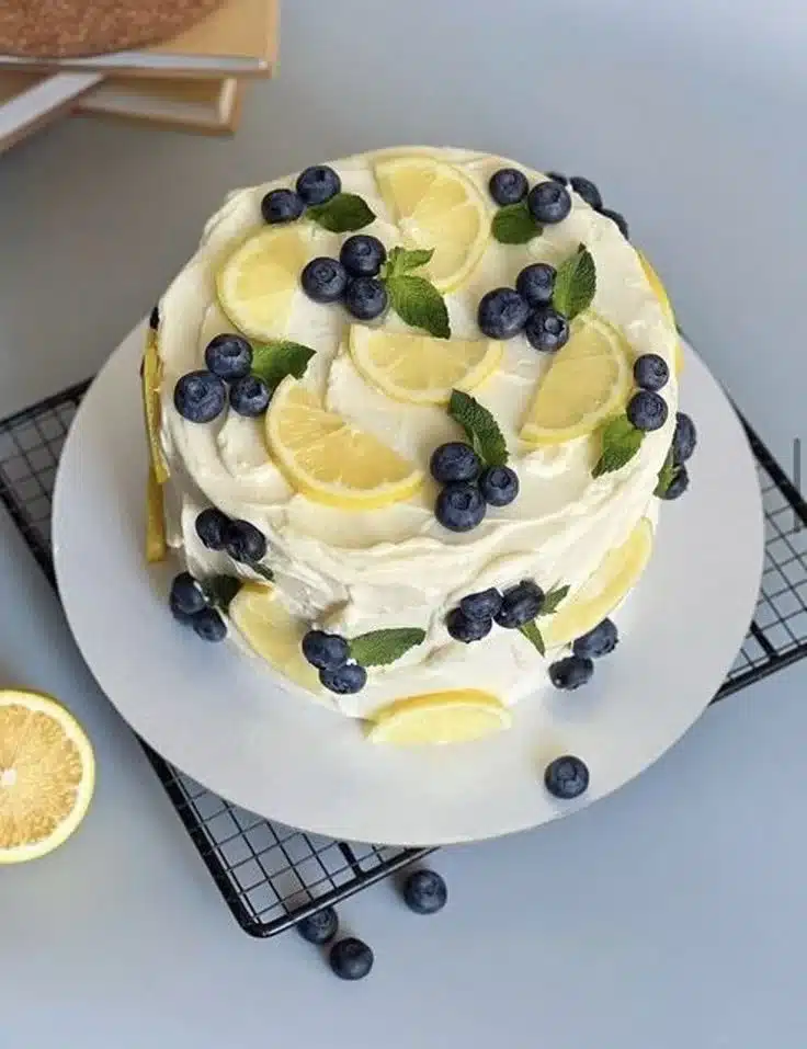Simple decorated cake with elegant frosting and colorful decorations.