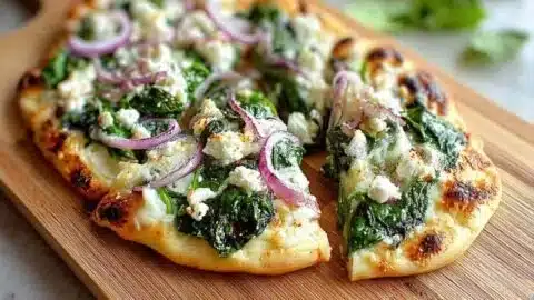 Spinach and Feta Flatbread Pizza topped with fresh ingredients