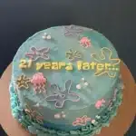 Colorful SpongeBob theme birthday cake decorated with Krabby Patty and jellyfish