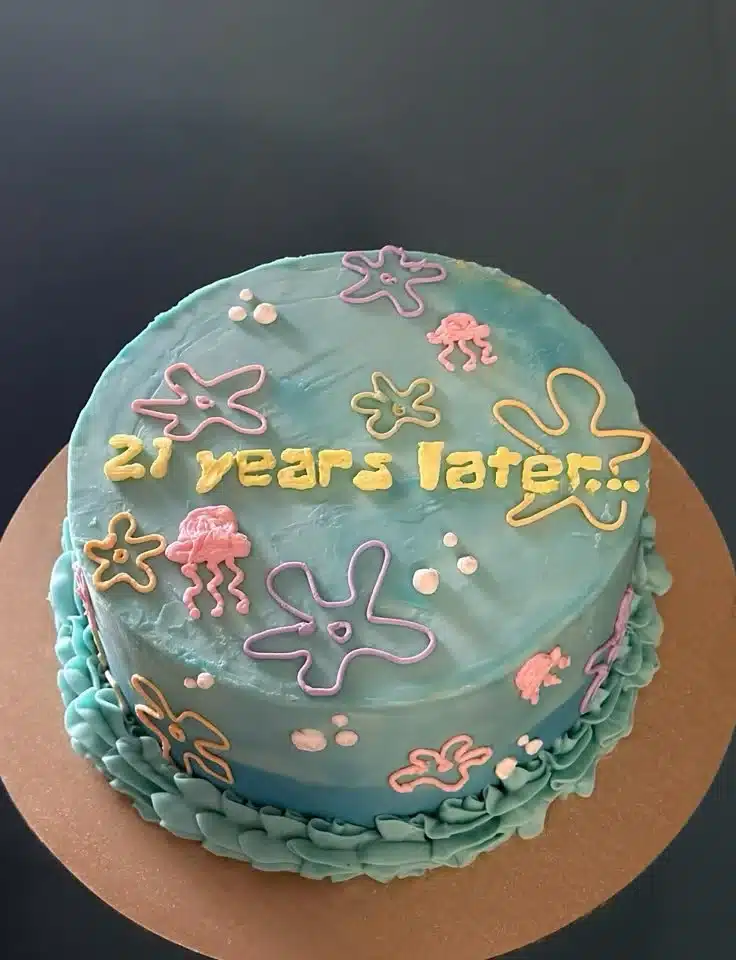 Colorful SpongeBob theme birthday cake decorated with Krabby Patty and jellyfish