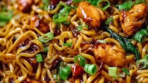 Delicious sticky garlic chicken noodles served in a bowl