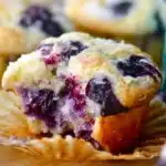 Freshly baked blueberry muffins on a cooling rack