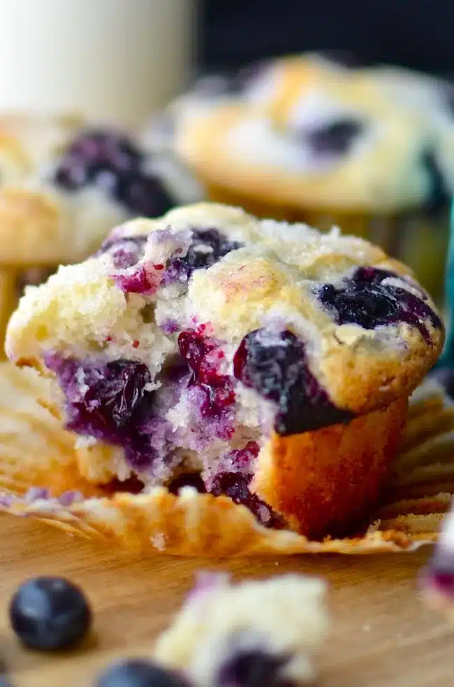 Freshly baked blueberry muffins on a cooling rack