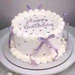 A beautifully decorated vintage cake with intricate details and soft pastel colors.