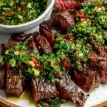 Grilled chimichurri steak topped with fresh herb sauce