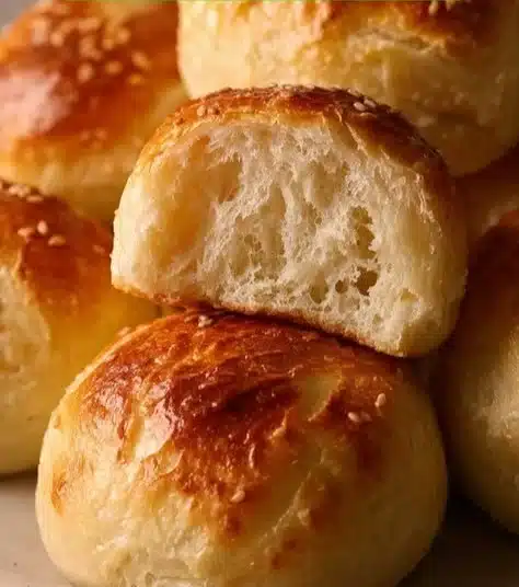 Cottage cheese burger buns on a wooden table ready for serving