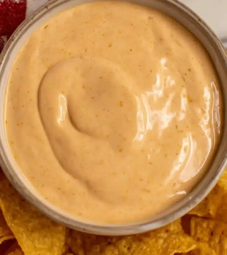 Delicious Cottage Cheese Queso served in a bowl with tortilla chips