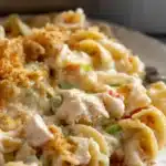 High protein creamy chicken noodle casserole served in a baking dish
