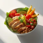 A variety of colorful Mediterranean lunch bowls filled with fresh ingredients.