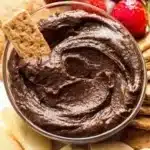 Delicious chocolate hummus served with fruits and crackers.