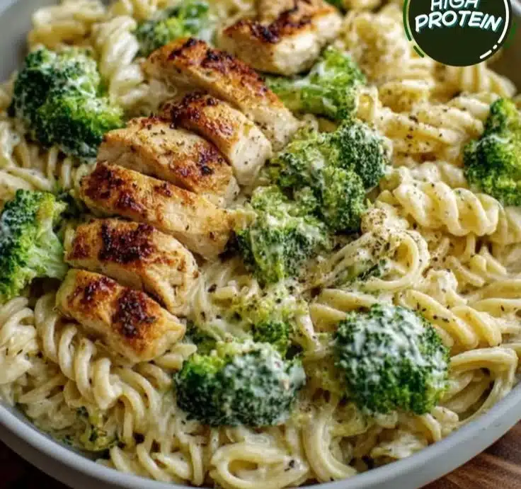Creamy pasta with rotisserie chicken and broccoli in a bowl