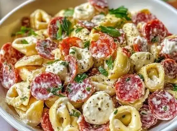 Bowl of Salami-Mozzarella Tortellini Pasta Salad with fresh ingredients