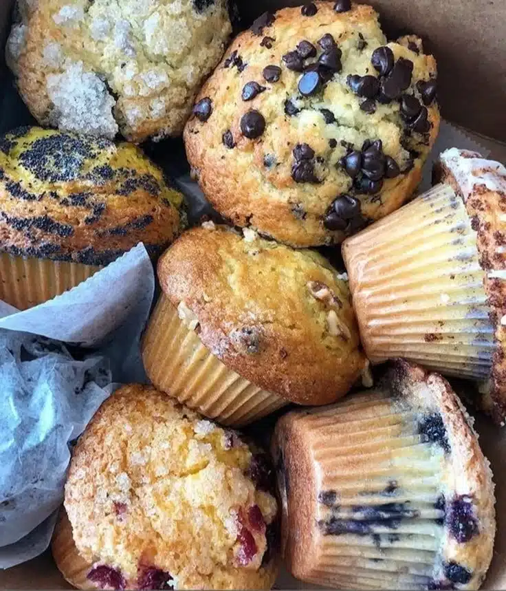 Freshly baked bakery style blueberry muffins with juicy blueberries