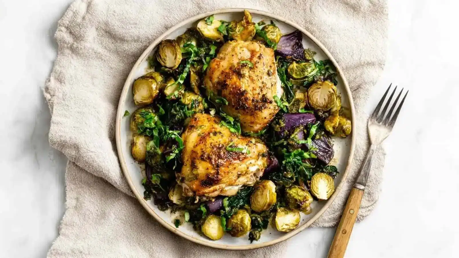 Balsamic roasted chicken served with Brussels sprouts on a plate