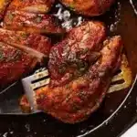 Delicious chicken breast dinner served with vegetables and herbs